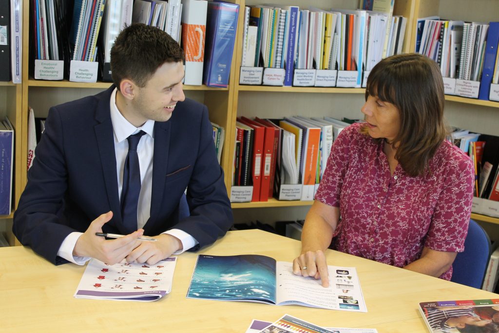 Woman and man reviewing Easy Read materials