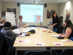 Facilitators and participant on a training course
