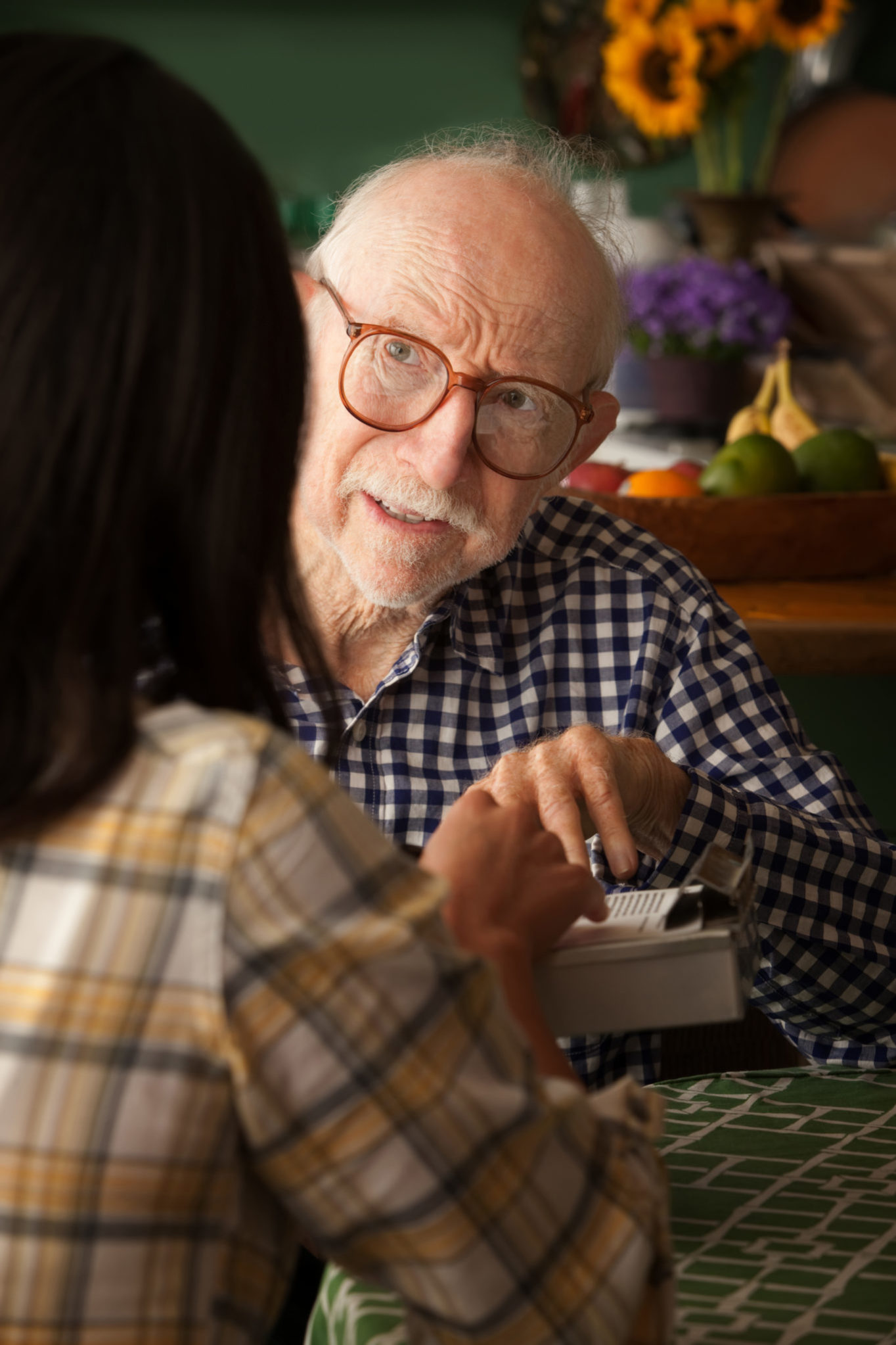 Older man talking to a woman