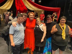 A group of Gig Buddies at a gig, infront of a circus tent