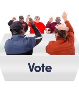 people in a meeting voting