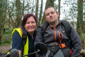 A male and female forestry worker taking a break at work in the grounds of Scolton Manor