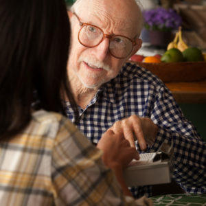 Older man talking to a woman