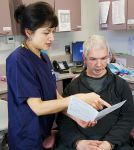 Health worker showing information to a patient