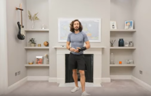 Joe Wicks doing exercises in his living room