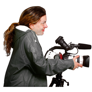 A woman is using a video camera