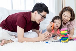 Parents playing with a child