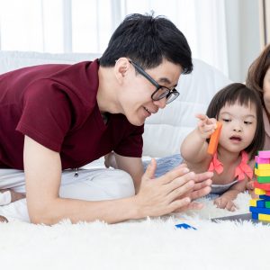 Parents playing with a child